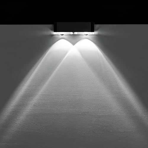 Dual beam lighting effect from solar fence lights illuminating a fence